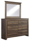 Juararo King Panel Bed with Mirrored Dresser, Chest and Nightstand Smyrna Furniture Outlet