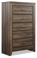 Juararo King Panel Bed with Mirrored Dresser, Chest and Nightstand Smyrna Furniture Outlet