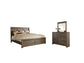 Juararo Queen Panel Bed with Mirrored Dresser Smyrna Furniture Outlet