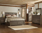 Juararo Queen Panel Bed with Mirrored Dresser Smyrna Furniture Outlet