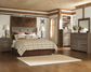 Juararo Queen Panel Headboard with Mirrored Dresser and Chest Smyrna Furniture Outlet