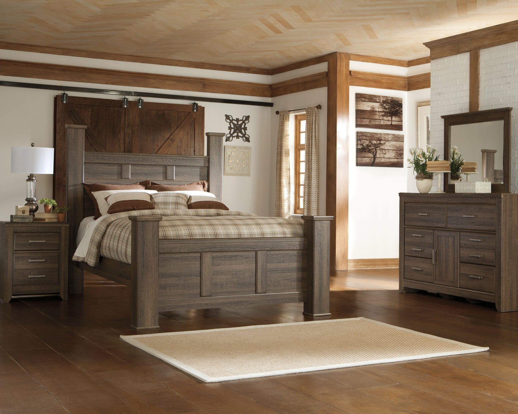 Juararo Queen Poster Bed with Mirrored Dresser and Chest Smyrna Furniture Outlet